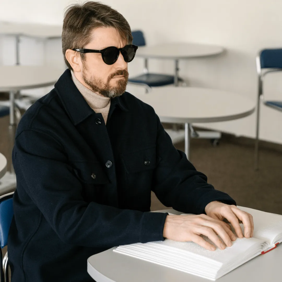 Person reading braille, representing blind treatment without X-rays